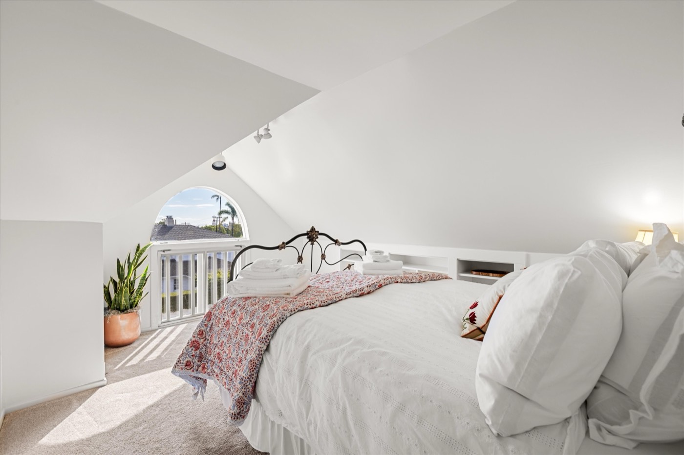 Attic bedroom with iron bed